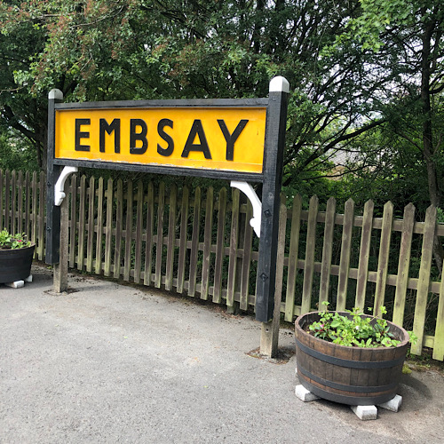 Railway station signage saying Embsay